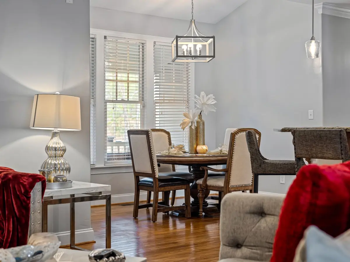 Finished living and dining room styled with furniture, lighting and accessories